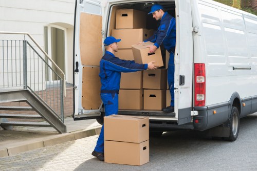 Customer moving storage items safely in a secure self storage facility