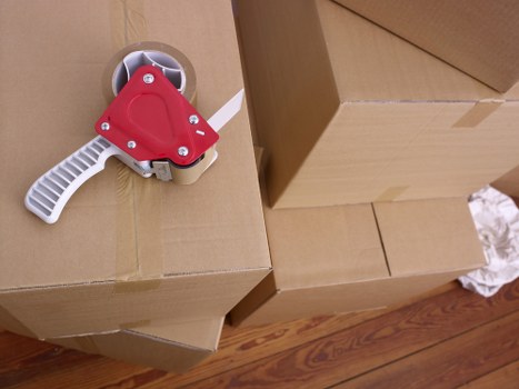 Local packing team preparing boxes in a South Kensington flat